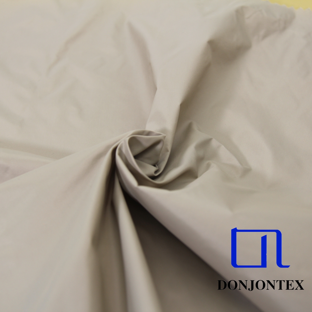 Hot Sale Down-proof Anti-wrinkle 380T Nylon Taffeta Cire Fabric For Down-proof Jacket